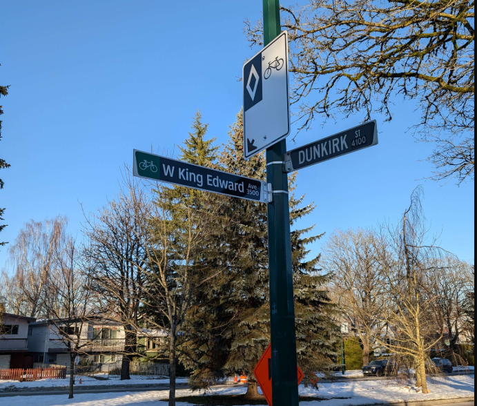 Photo of a bike lane sign at the intersection of King Edward and Dunkirk in Dunbar